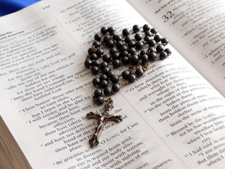 Rosary on an open Bible